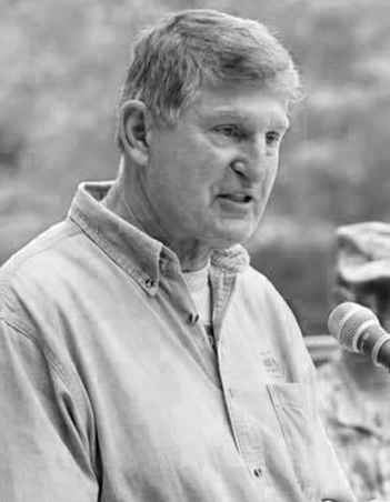 Joe Manchin speaking into a microphone